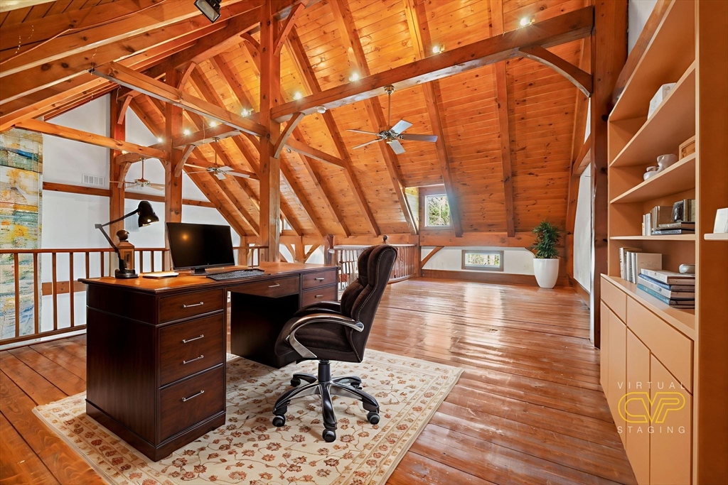 219 Chase Road Dartmouth, MA 02747 - Photo 15 of 42 a view of a workspace with furniture and wooden floor