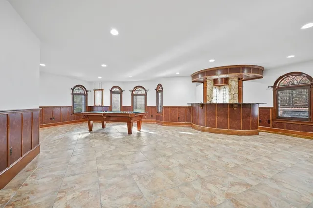 a view of living room filled with furniture and window