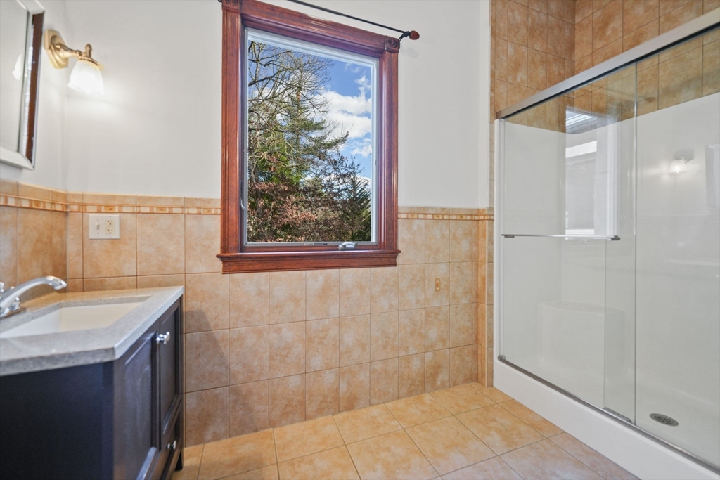 219 Chase Road Dartmouth, MA 02747 - Photo 29 of 42 a bathroom with a sink and a mirror
