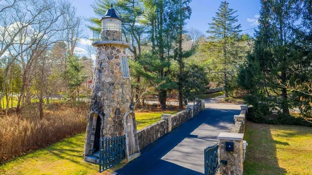 a view of swimming pool with sitting area and garden