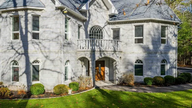 a front view of a house with a yard