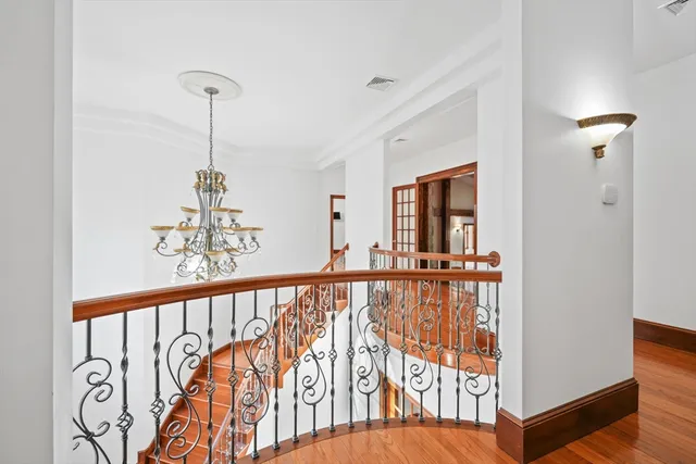 a view of a hallway with a chandelier