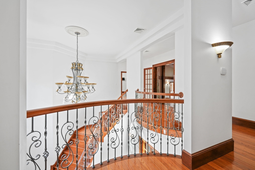 219 Chase Road Dartmouth, MA 02747 - Photo 7 of 42 a view of a hallway with a chandelier