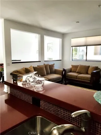 a living room with furniture window and couch