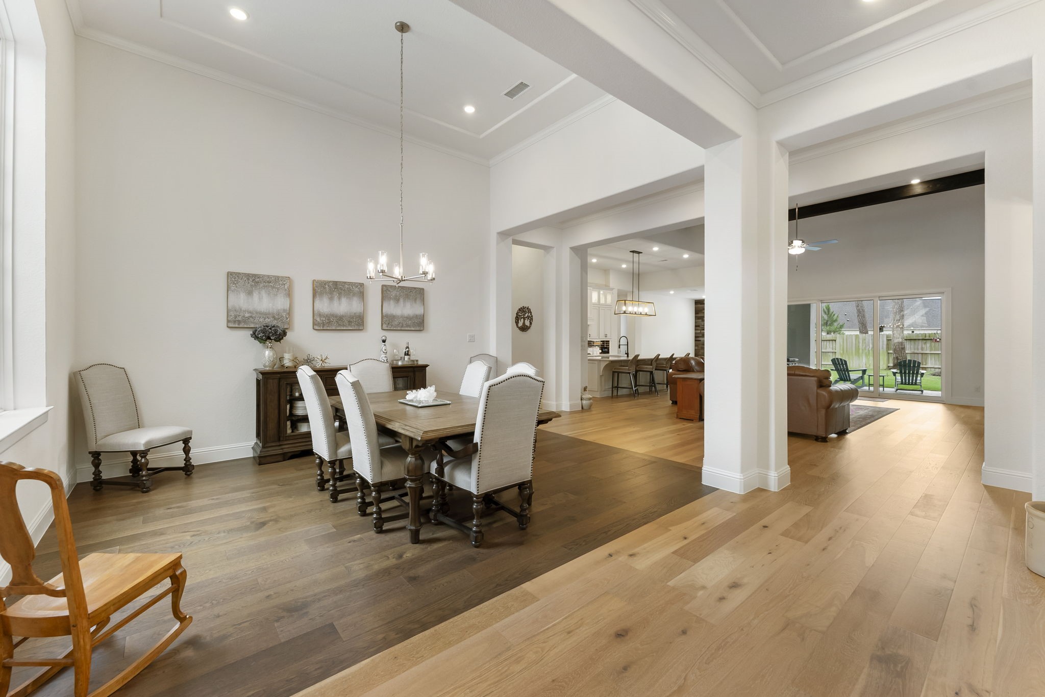 12932 Whitewater Way Conroe, TX 77302 - Photo 5 of 48 Formal dining room featuring soaring tray ceilings and abundant natural light.