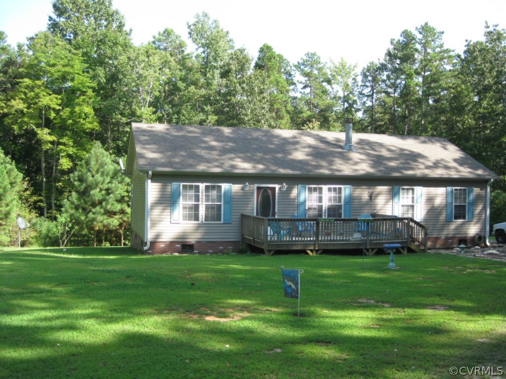 a front view of a house with a yard table and chairs