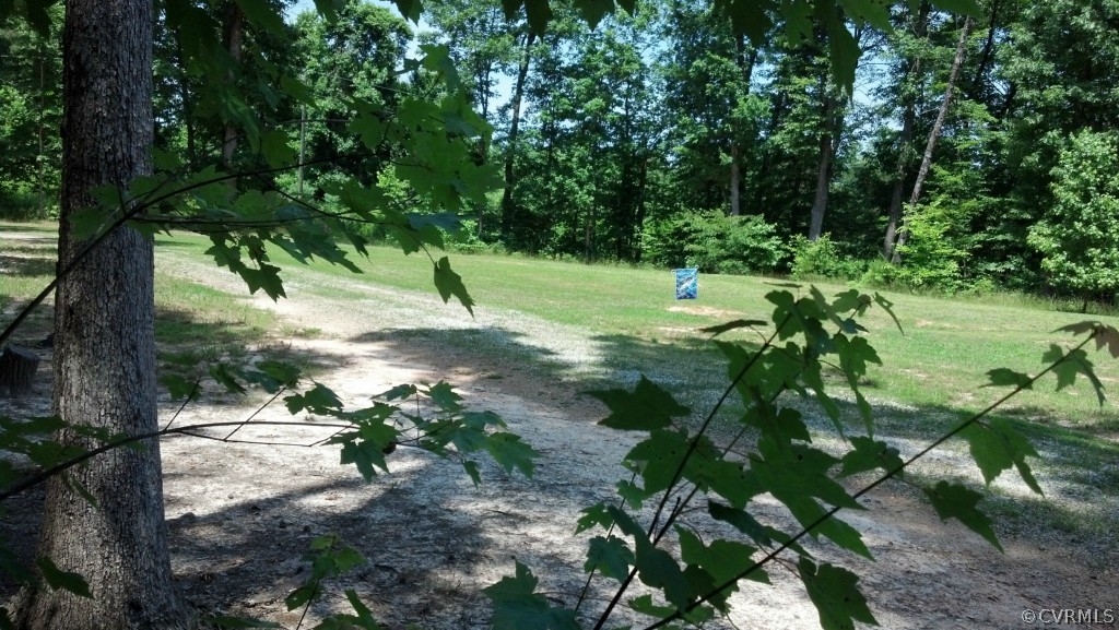 4520 Plank Road Kenbridge, VA 23944 - Photo 13 of 13 a backyard of a house with a yard and outdoor seating