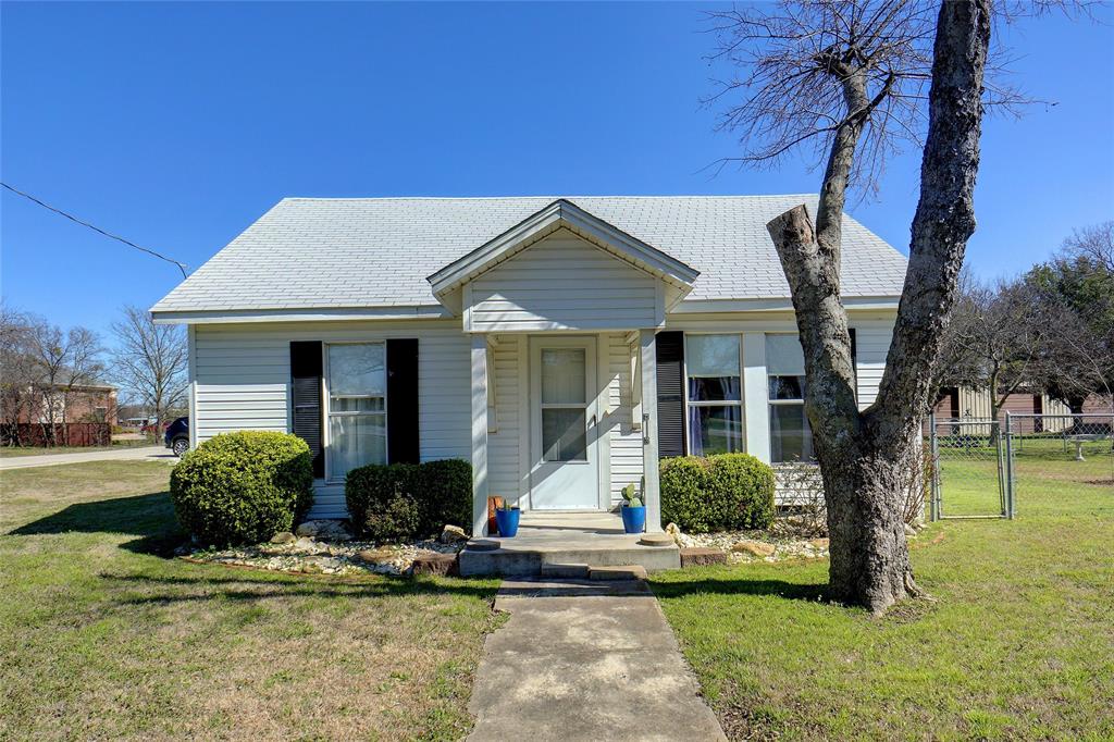206 Shaffner Street Ponder, TX 76259 - Photo 1 of 1 a front view of a house with garden