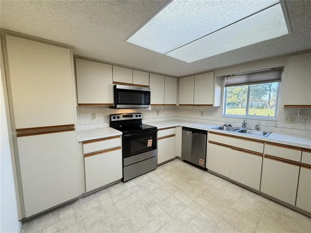 a view of a closet with wooden floor