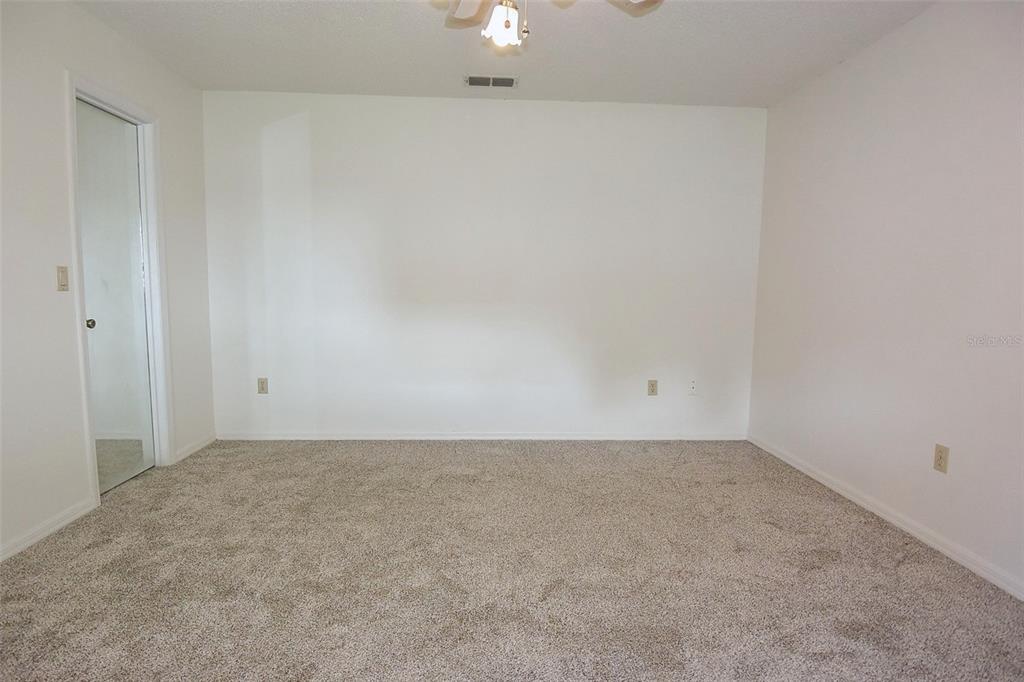 10980 Southwest 62nd Avenue Ocala, FL 34476 - Photo 18 of 48 a view of an empty room and chandelier fan