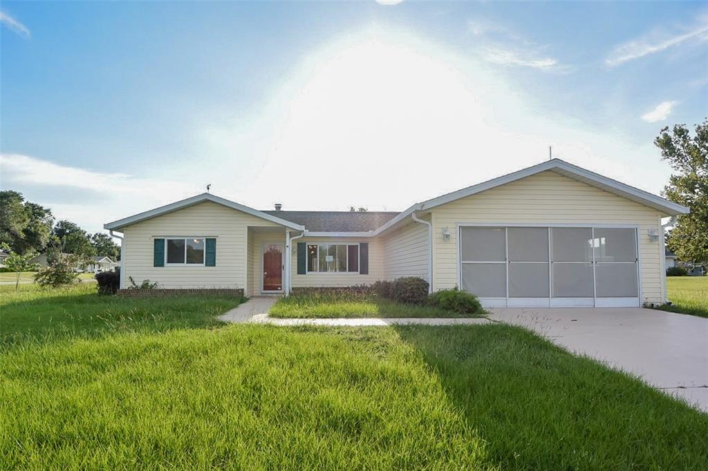 10980 Southwest 62nd Avenue Ocala, FL 34476 - Photo 2 of 48 a view of a house with a yard