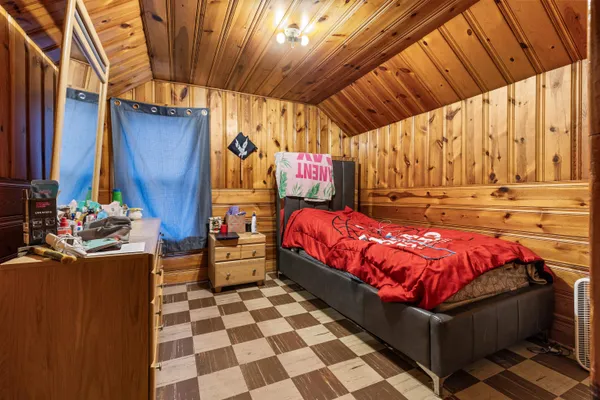 a bed room with a bed and a black umbrella