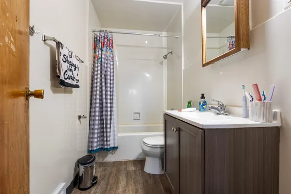 a bathroom with a sink toilet and shower