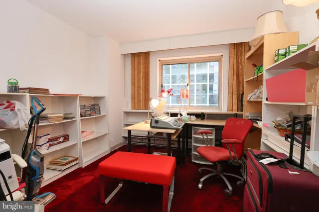 a room with furniture a rug and a window