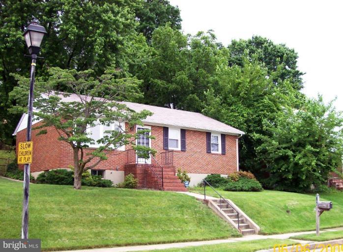 8208 Edwill Avenue Rosedale, MD 21237 - Photo 1 of 18 a front view of a house with a yard