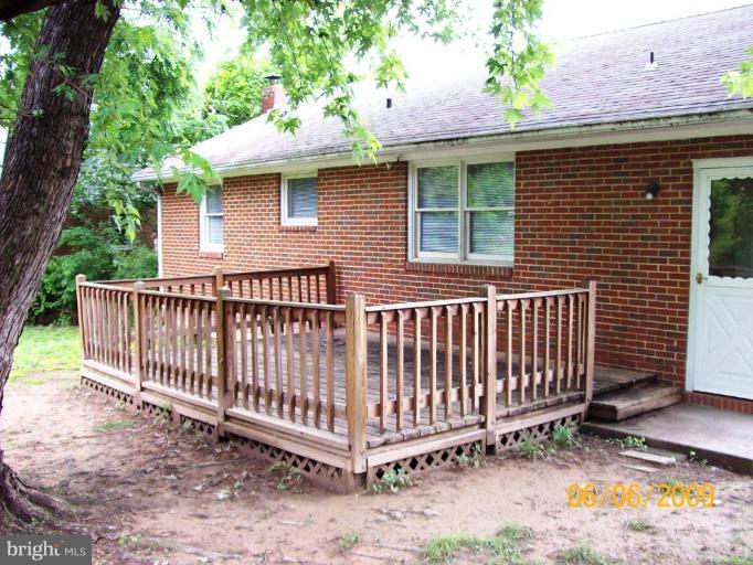 8208 Edwill Avenue Rosedale, MD 21237 - Photo 2 of 18 a view of a small yard with a deck