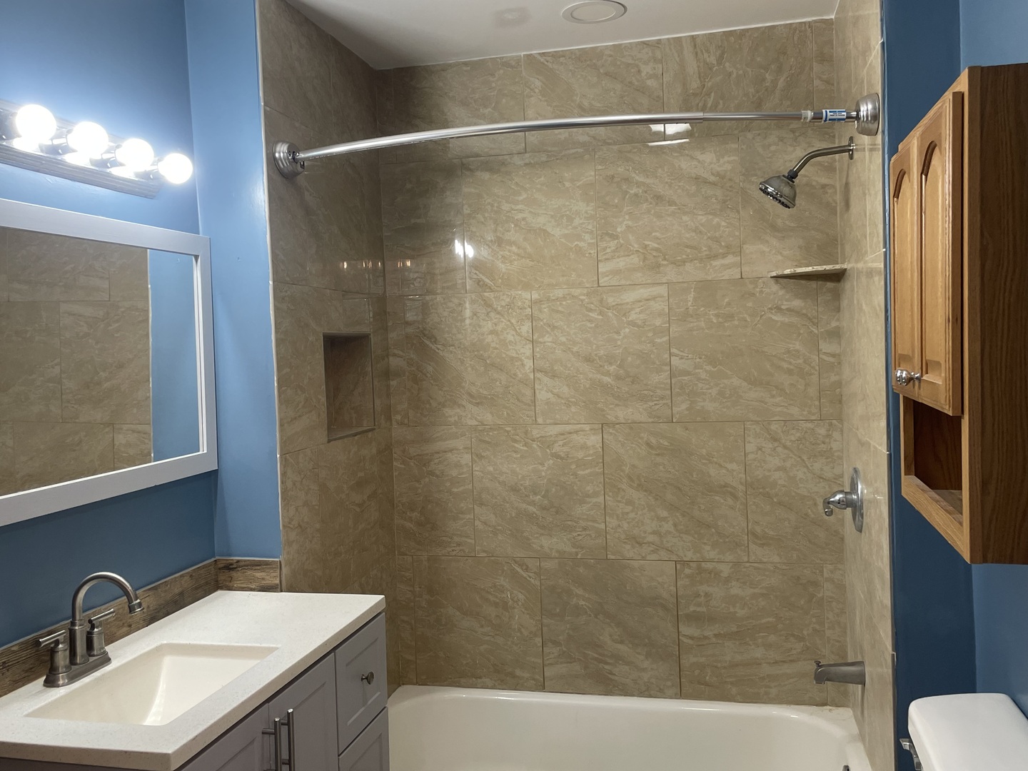 214 North 3rd Street Clinton, IA 52732 - Photo 11 of 11 a bathroom with a sink mirror toilet and bathtub