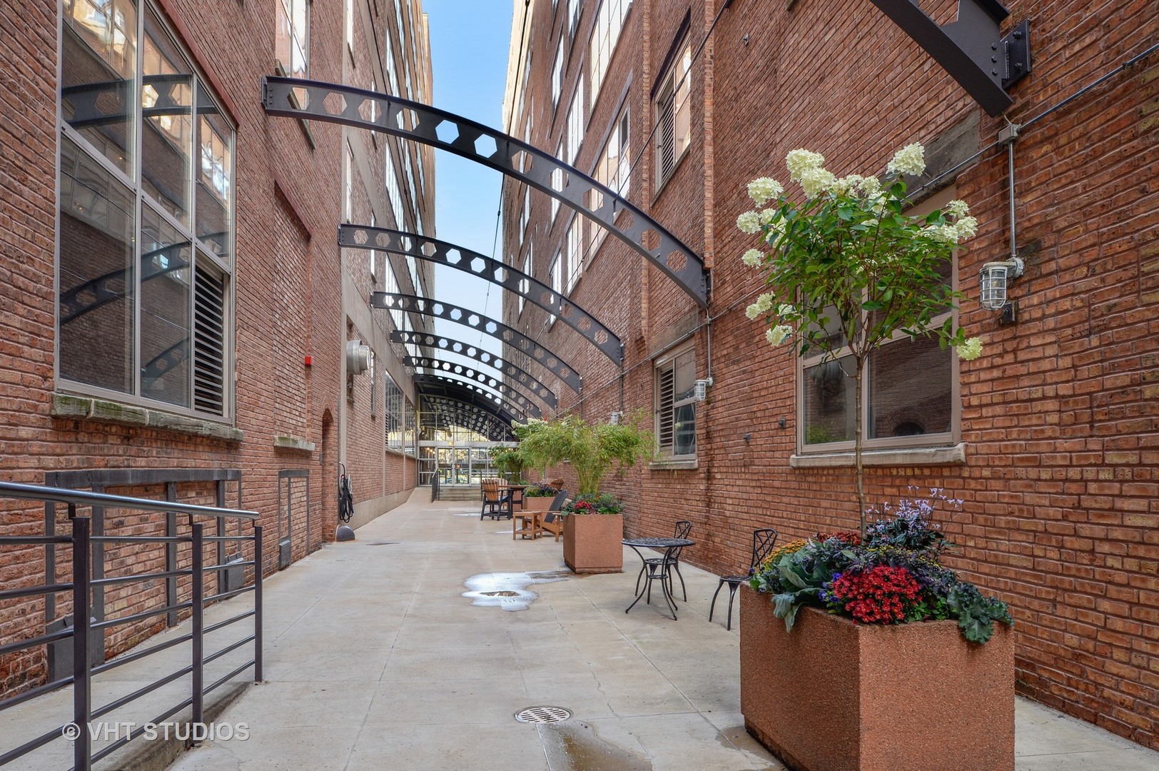 500 South Clinton Street, Unit 542 Chicago, IL 60607 - Photo 14 of 14 a potted plant sitting in front of a brick building