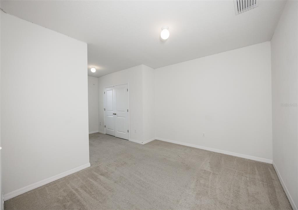 8969 Indigo Trail Loop Riverview, FL 33578 - Photo 31 of 41 an empty room with a workbench