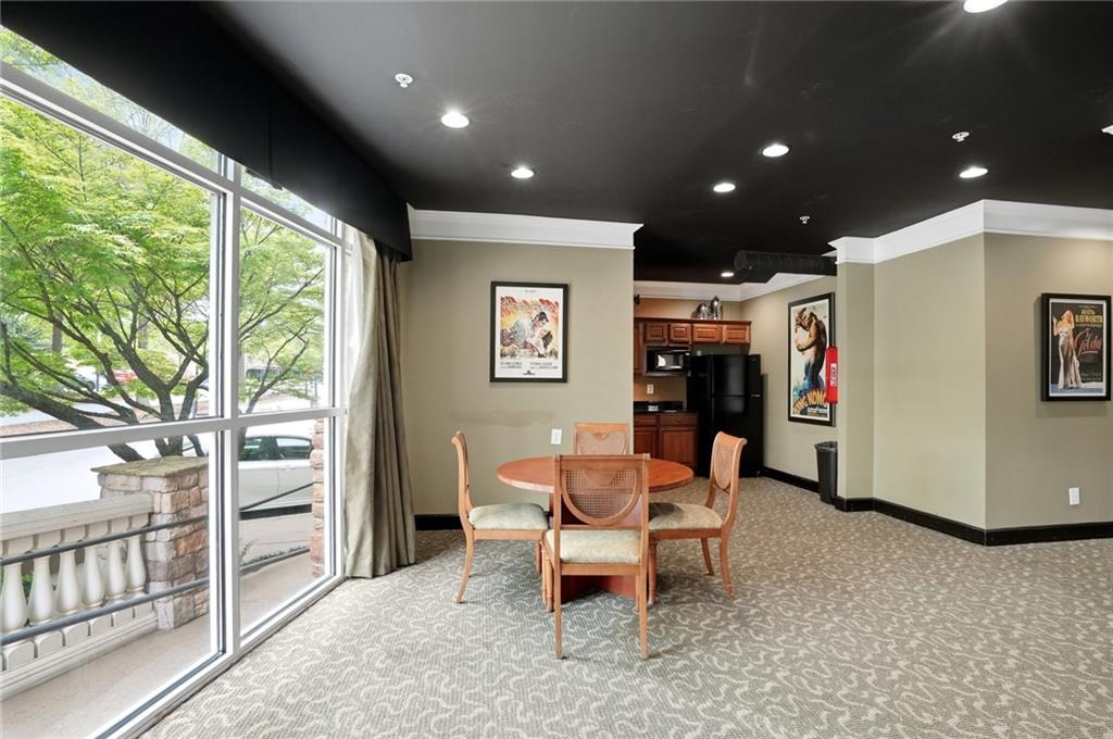 10 Perimeter Summit Boulevard, Unit 1204 Atlanta, GA 30319 - Photo 22 of 39 a dining room with furniture and a window