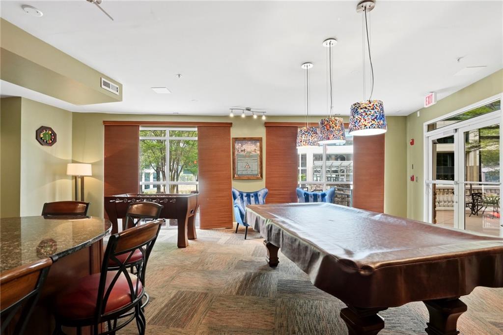 10 Perimeter Summit Boulevard, Unit 1204 Atlanta, GA 30319 - Photo 23 of 39 a view of a dining room with furniture window and outside view