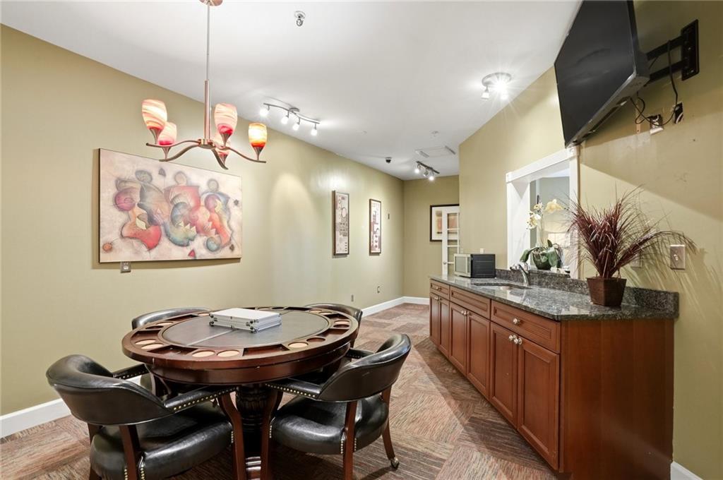 10 Perimeter Summit Boulevard, Unit 1204 Atlanta, GA 30319 - Photo 29 of 39 a view of a dining room with furniture