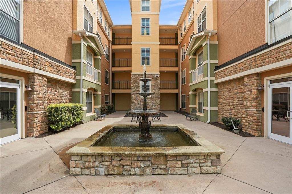 10 Perimeter Summit Boulevard, Unit 1204 Atlanta, GA 30319 - Photo 35 of 39 a view of a building with a fountain