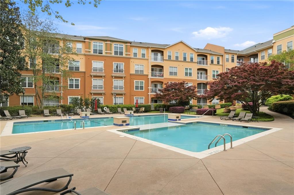 10 Perimeter Summit Boulevard, Unit 1204 Atlanta, GA 30319 - Photo 38 of 39 a view of a house with a swimming pool