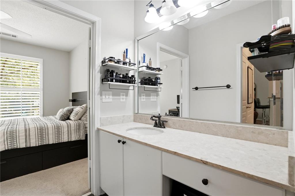 10 Perimeter Summit Boulevard, Unit 1204 Atlanta, GA 30319 - Photo 7 of 39 a bathroom with a sink and a mirror