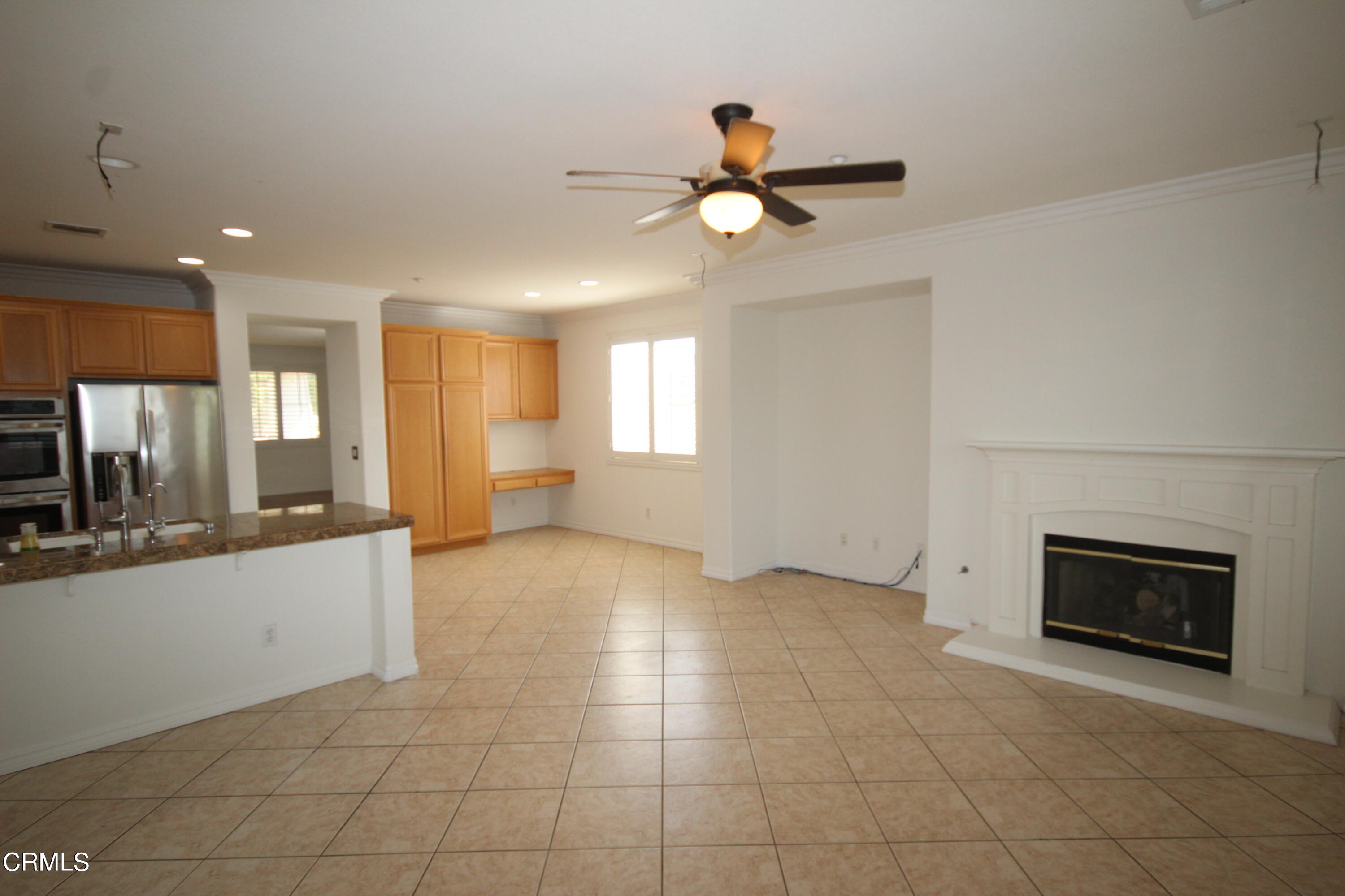 1034 Caliente Way Oxnard, CA 93036 - Photo 12 of 12 a view of a livingroom with a fireplace and window