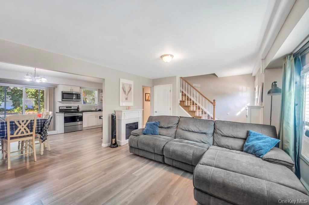 382 Boyle Road Selden, NY 11784 - Photo 11 of 26 a living room with furniture and wooden floor