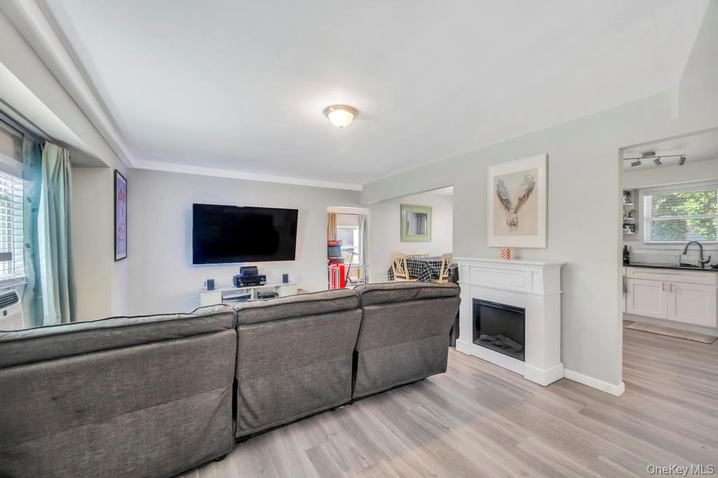 382 Boyle Road Selden, NY 11784 - Photo 13 of 26 a living room with furniture and a flat screen tv