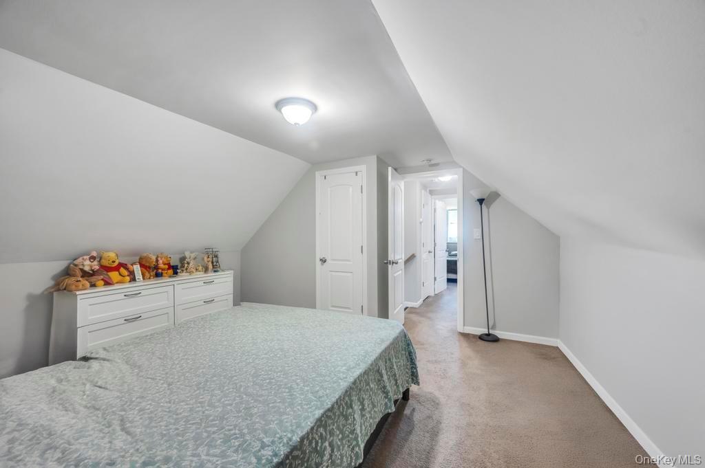 382 Boyle Road Selden, NY 11784 - Photo 22 of 26 a bedroom with a bed and closet