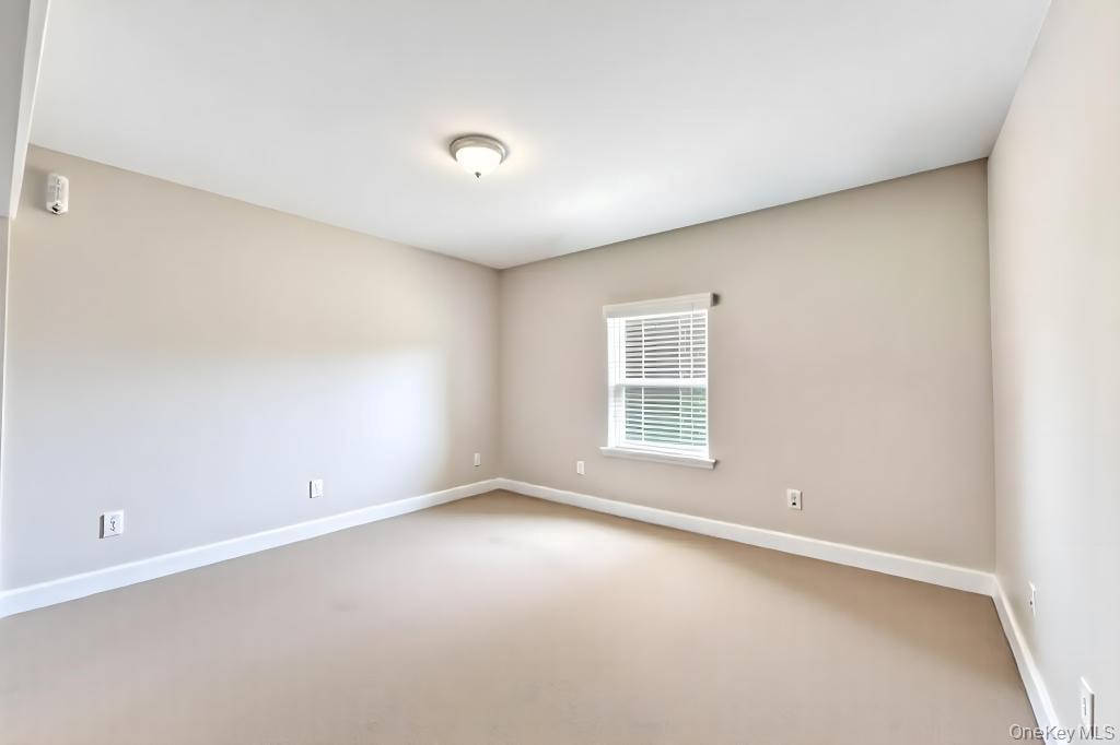 382 Boyle Road Selden, NY 11784 - Photo 26 of 26 an empty room with a window