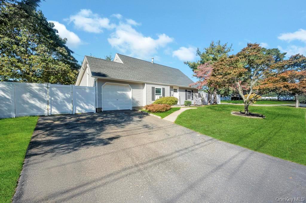 382 Boyle Road Selden, NY 11784 - Photo 3 of 26 a view of a house with a yard and large tree