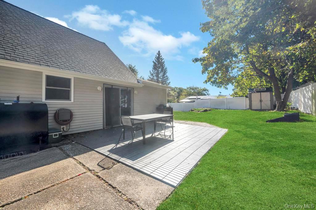382 Boyle Road Selden, NY 11784 - Photo 7 of 26 a view of a backyard with sitting area