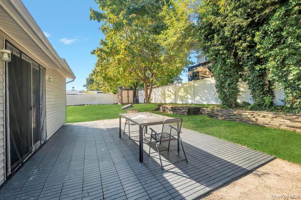 382 Boyle Road Selden, NY 11784 - Photo 8 of 26 a view of a backyard with sitting area
