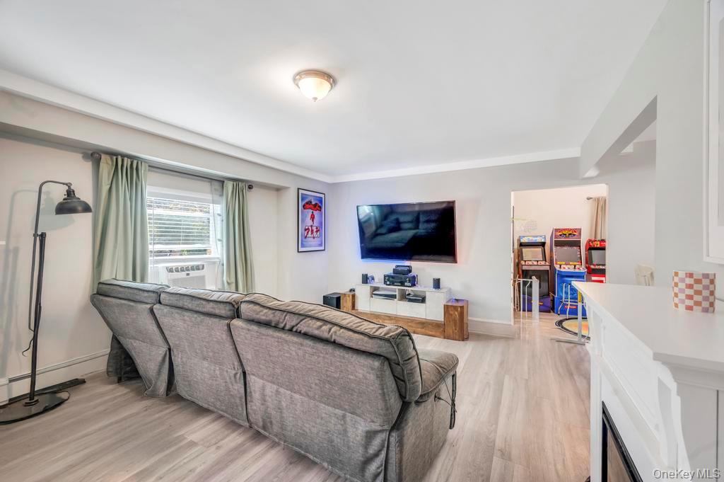 382 Boyle Road Selden, NY 11784 - Photo 10 of 26 a living room with furniture and a flat screen tv
