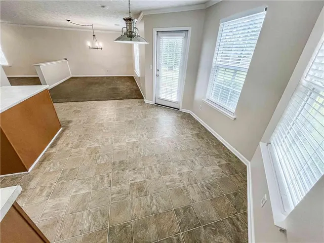 a view of entryway with kitchen