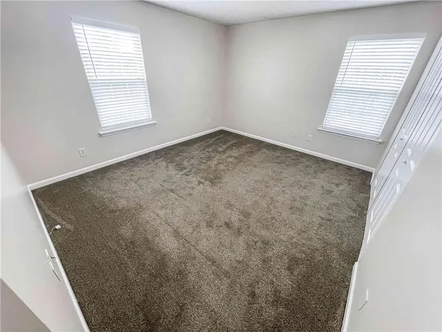 an empty room with a wooden door