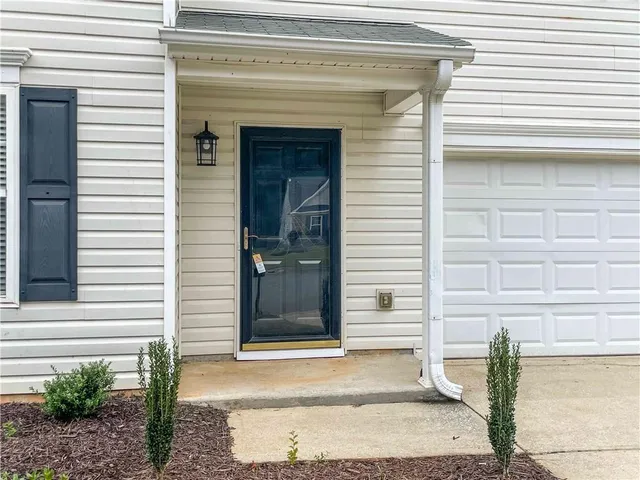 a front view of a house with a garage
