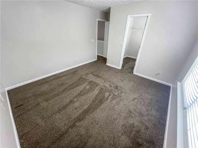 a view of a trees with a yard