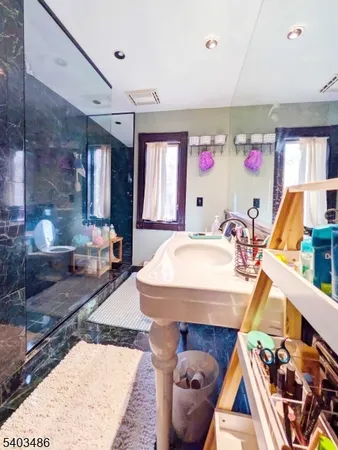 a bathroom with a sink a toilet and bathtub