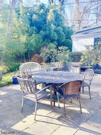 a view of a backyard with sitting area