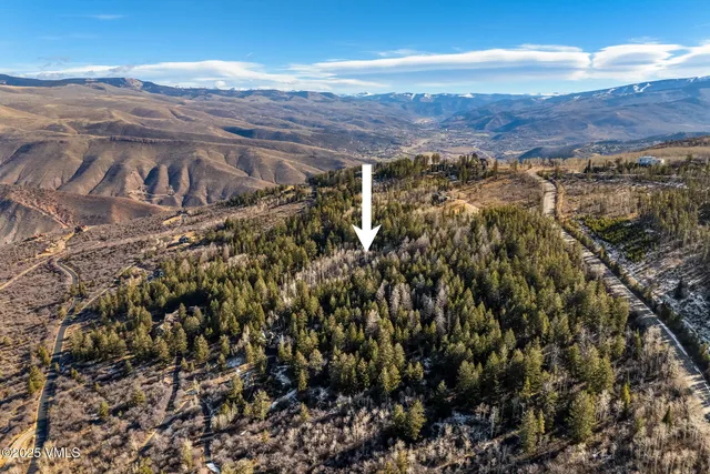 a view of an ocean with a mountain