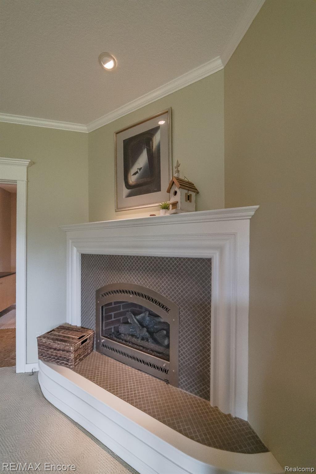 5903 Oakhill Road Clarkston, MI 48348 - Photo 30 of 72 Elegant gas fireplace with detailed white trim