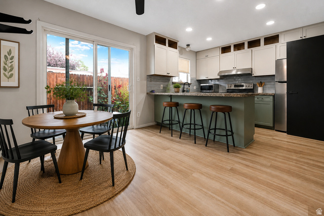 285 West 600 North, Unit 2 Logan, UT 84321 - Photo 5 of 21 Open-concept kitchen and dining area featuring light-toned wood-finish flooring