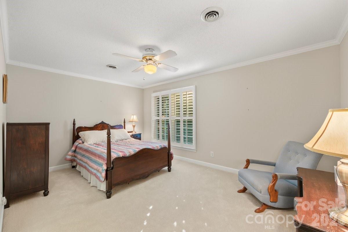 207 Lost Corner Road Morganton, NC 28655 - Photo 38 of 46 a spacious bedroom with a bed and a window
