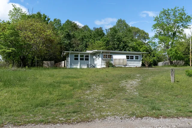 a view of a house with a big yard