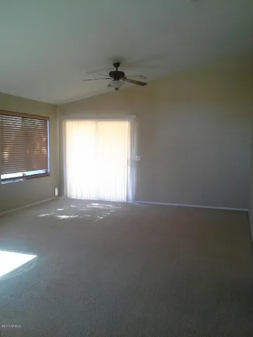 an empty room with a empty space and windows